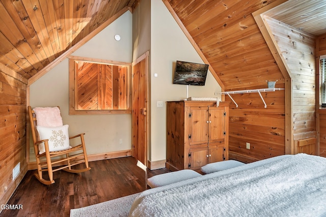 bedroom with vaulted ceiling, wood ceiling, wood finished floors, baseboards, and wood walls