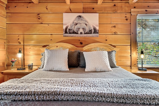 bedroom featuring wooden walls