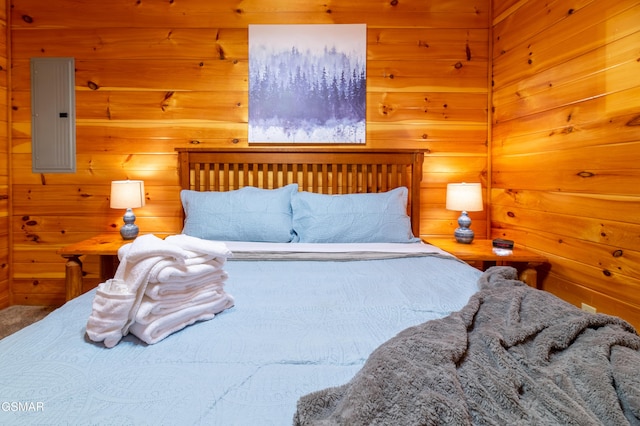 bedroom with wooden walls and electric panel