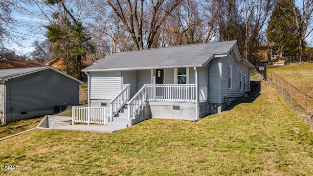 single story home featuring a porch, a front yard, crawl space, and fence