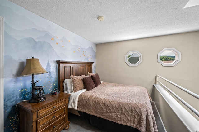 bedroom with carpet flooring and a textured ceiling