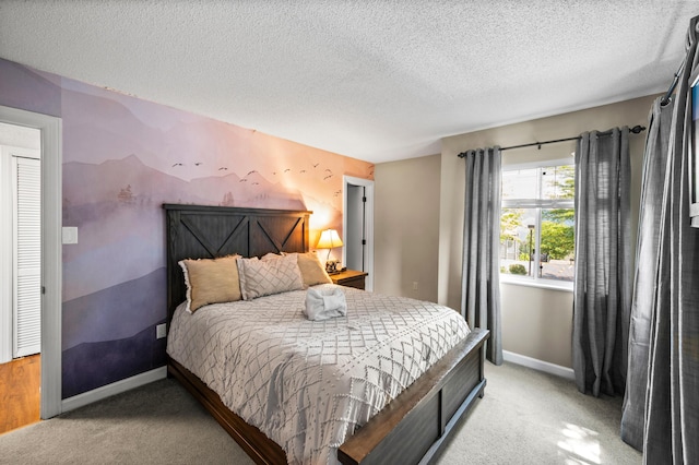 carpeted bedroom featuring a textured ceiling