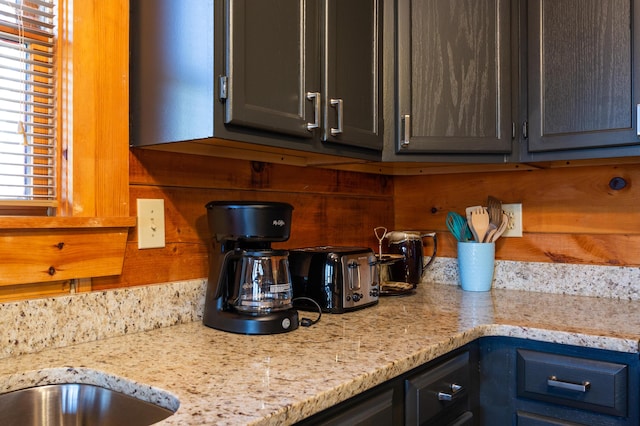 kitchen with light stone countertops