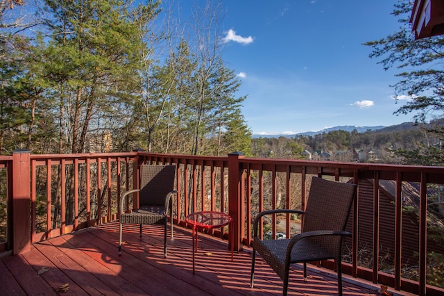 wooden deck featuring a mountain view