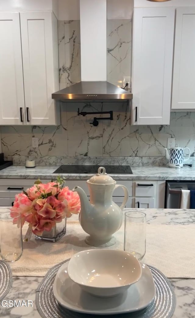2438 Daniels Dr, Morristown, TN 37813 - kitchen with wall chimney range hood, decorative backsplash, white cabinetry, and black electric stovetop