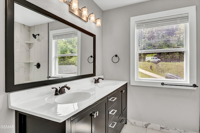 2438 Daniels Dr, Morristown, TN 37813 - full bathroom featuring double vanity, marble finish flooring, baseboards, and a shower