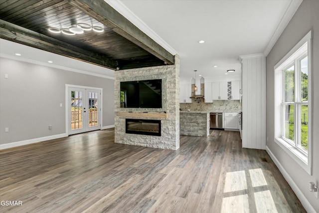 2438 Daniels Dr, Morristown, TN 37813 - unfurnished living room featuring dark wood-style floors, a stone fireplace, baseboards, french doors, and crown molding