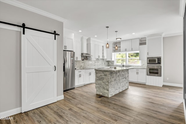 2438 Daniels Dr, Morristown, TN 37813 - kitchen with appliances with stainless steel finishes, wall chimney range hood, ornamental molding, tasteful backsplash, and baseboards