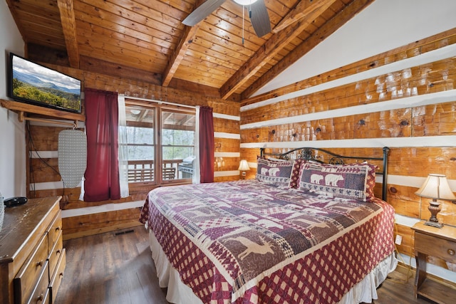 bedroom with wooden ceiling, vaulted ceiling with beams, wood walls, and dark wood finished floors
