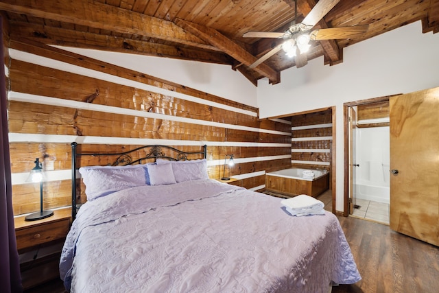 bedroom with lofted ceiling with beams, ensuite bathroom, wood walls, wood finished floors, and wooden ceiling