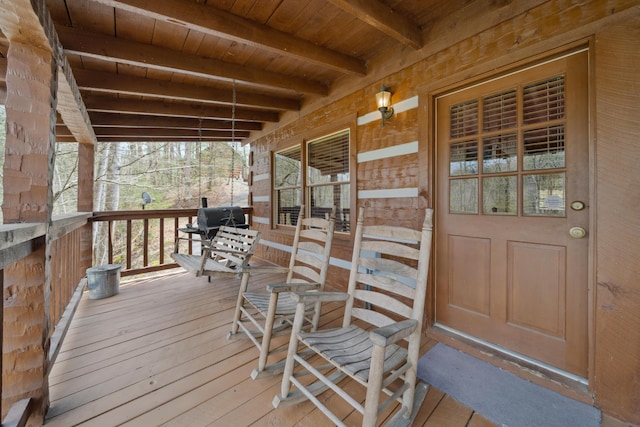 wooden terrace featuring a porch