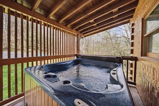 deck featuring a hot tub