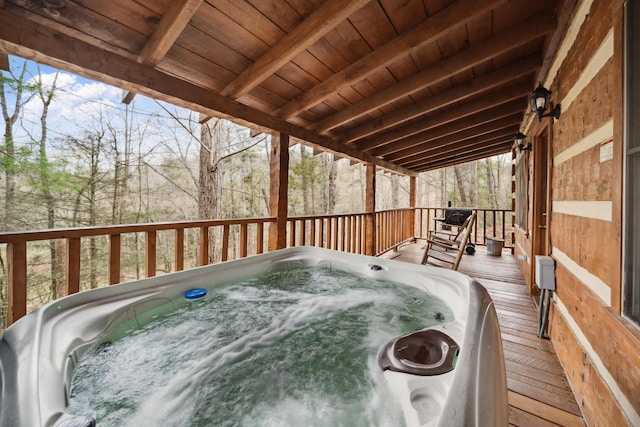 deck with a hot tub