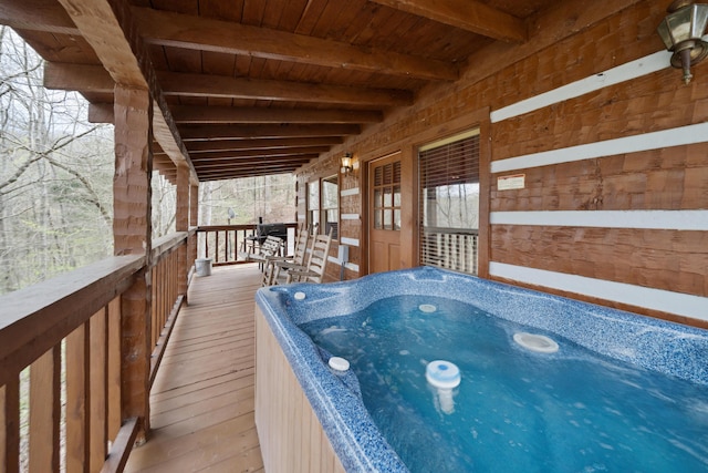 wooden deck featuring an indoor hot tub