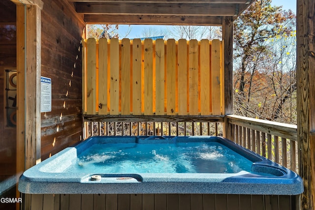 deck featuring a hot tub