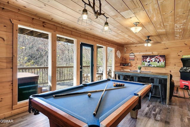 rec room with billiards, wooden ceiling, wooden walls, ceiling fan, and hardwood / wood-style floors