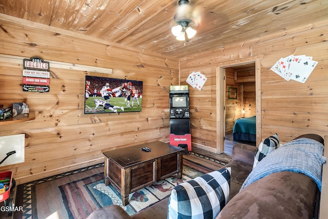 living room featuring wood ceiling and wood walls