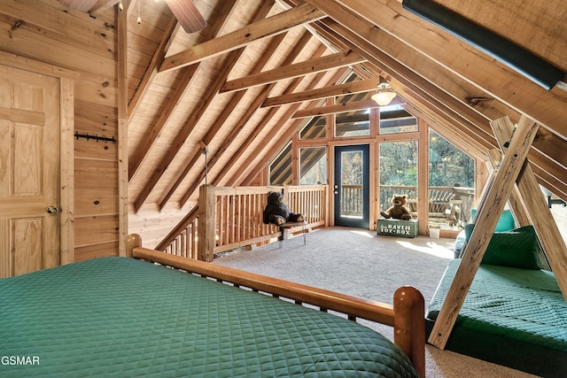 unfurnished bedroom featuring carpet, vaulted ceiling with beams, and wooden ceiling