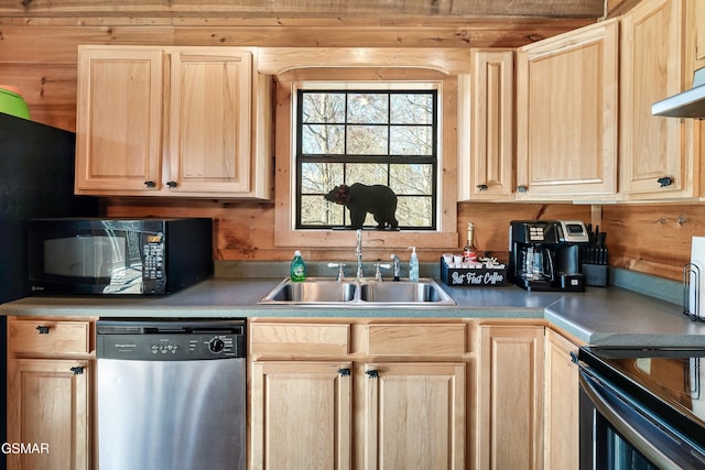 kitchen featuring wooden walls, sink, stainless steel dishwasher, and light brown cabinets