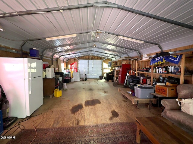 garage with freestanding refrigerator