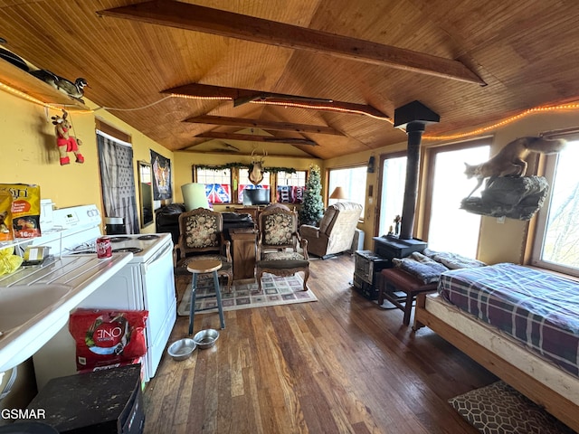 bedroom featuring wood ceiling, vaulted ceiling with beams, a wood stove, and wood finished floors