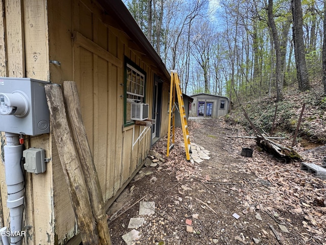 view of side of property with cooling unit