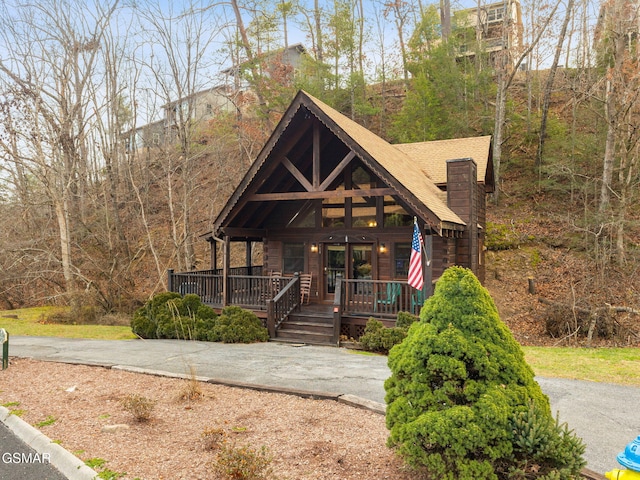 log home with covered porch