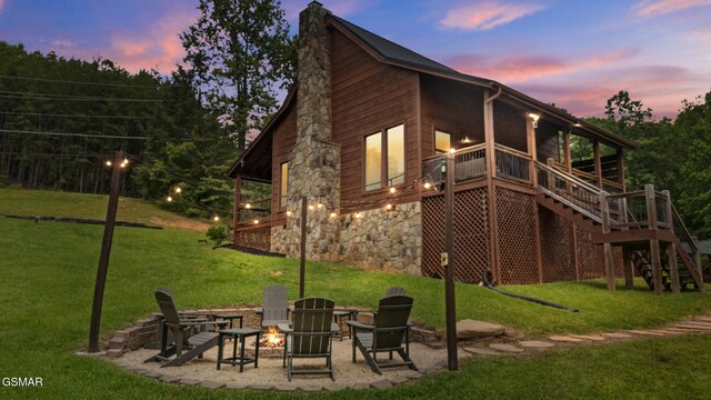 3955 Millers Ridge Way, Sevierville, TN 37862 - back of house with an outdoor fire pit, a lawn, stairs, and a wooden deck