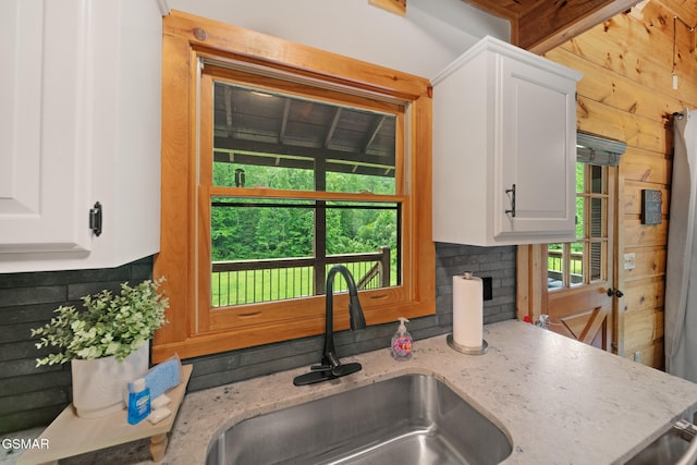3955 Millers Ridge Way, Sevierville, TN 37862 - kitchen with tasteful backsplash, white cabinets, and light stone countertops