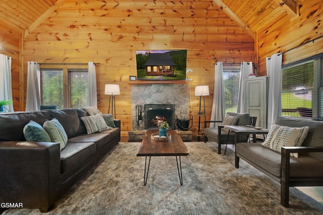 3955 Millers Ridge Way, Sevierville, TN 37862 - living room featuring lofted ceiling, wooden ceiling, wood walls, and a stone fireplace