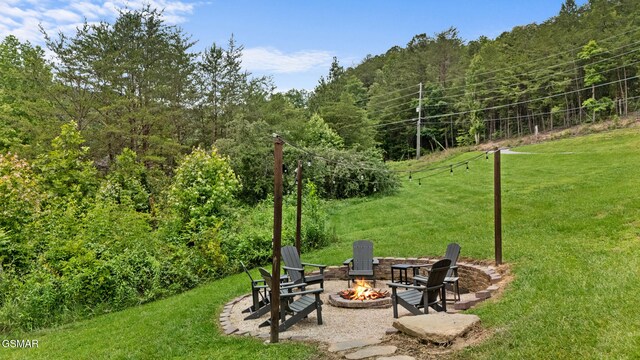 3955 Millers Ridge Way, Sevierville, TN 37862 - view of green lawn with an outdoor fire pit and a view of trees