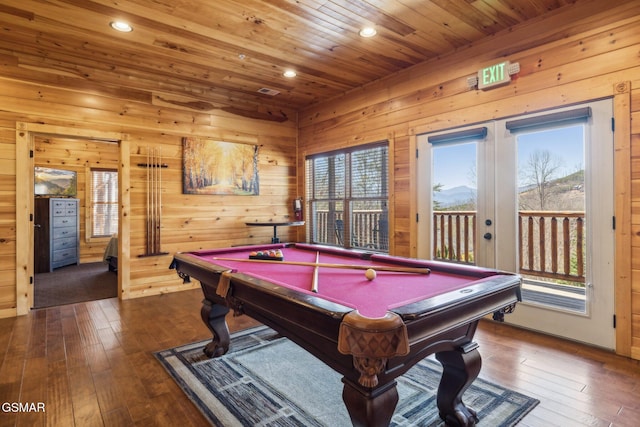 rec room with billiards, french doors, wood-type flooring, wood walls, and wood ceiling