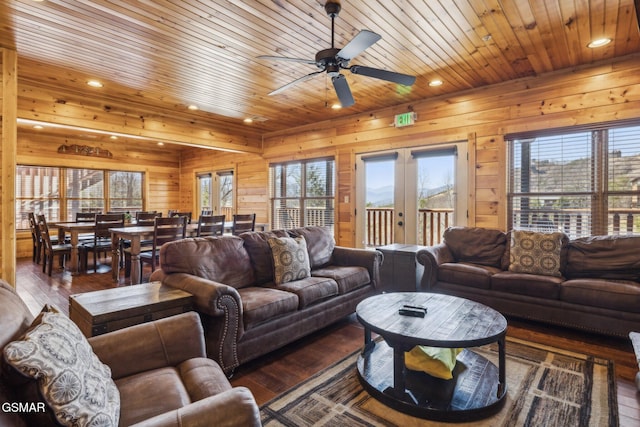 living room featuring wooden walls, hardwood / wood-style floors, recessed lighting, wooden ceiling, and french doors