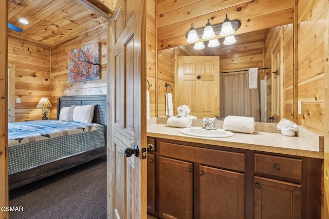 bathroom with wood walls, wood ceiling, and vanity