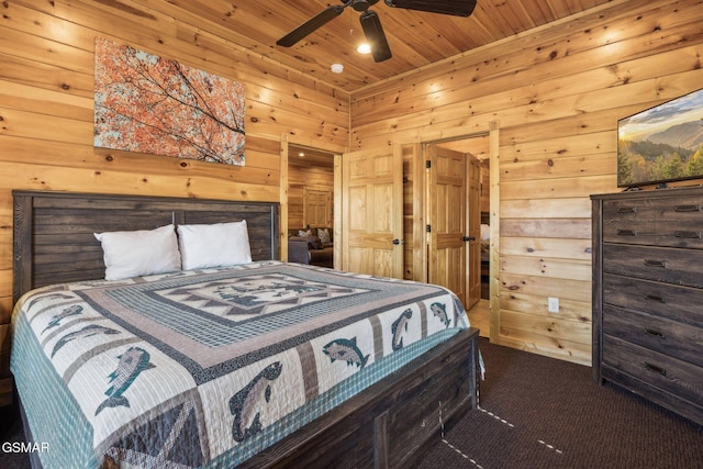 bedroom with wood ceiling, wooden walls, carpet, and ceiling fan