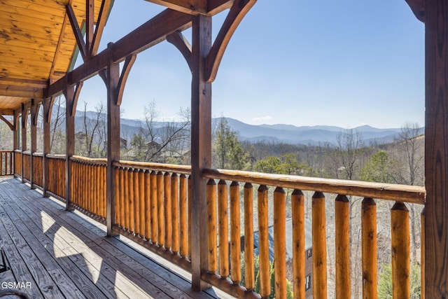 deck with a mountain view and a wooded view