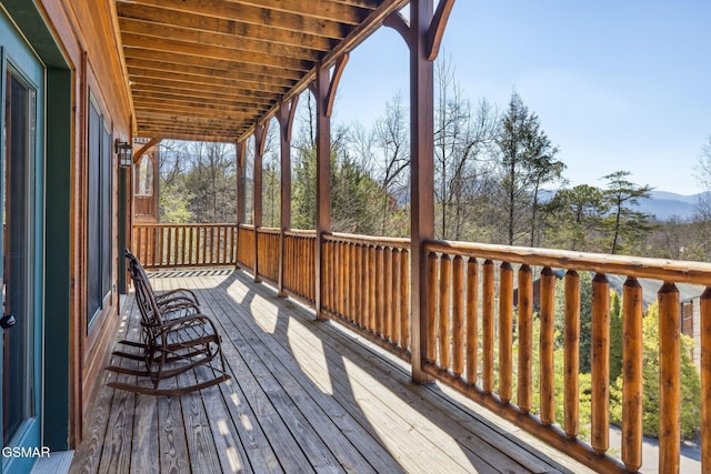 wooden deck featuring a mountain view