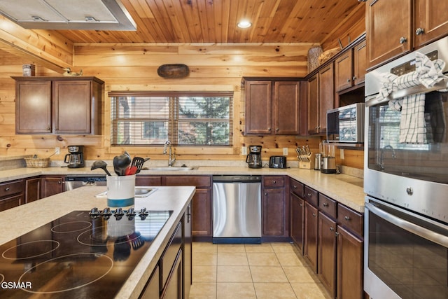 kitchen with light tile patterned floors, appliances with stainless steel finishes, wood ceiling, and a sink