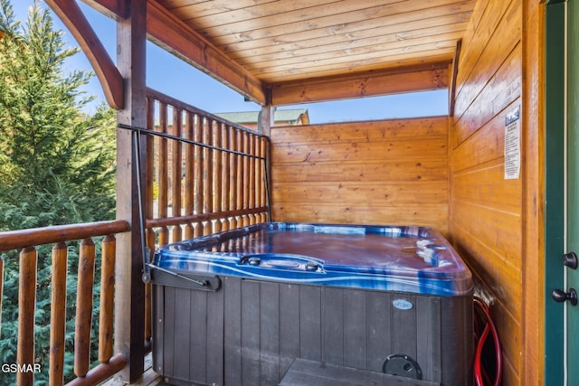 deck featuring a hot tub