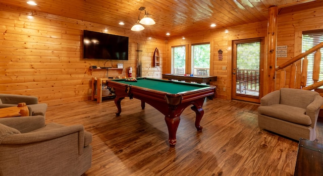 game room featuring wood-type flooring, wood walls, wooden ceiling, and pool table