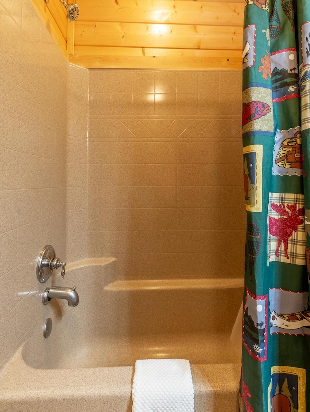 bathroom featuring shower / tub combo with curtain