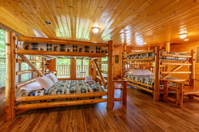 bedroom with hardwood / wood-style floors and wooden ceiling