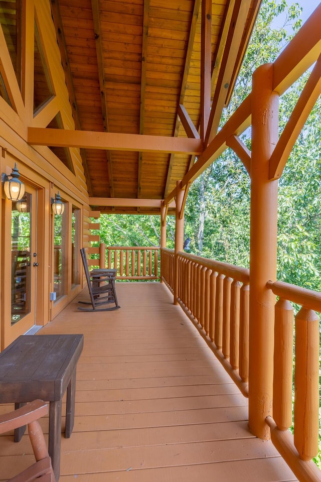 wooden terrace featuring covered porch