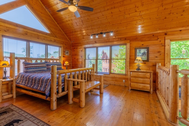 bedroom with wood ceiling, ceiling fan, and light hardwood / wood-style floors