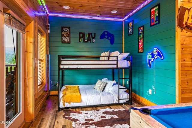 bedroom featuring wood ceiling and wood finished floors