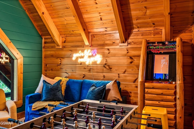 game room with beamed ceiling, wood ceiling, and wood walls