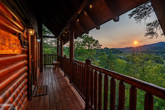 wooden terrace with a mountain view and a wooded view