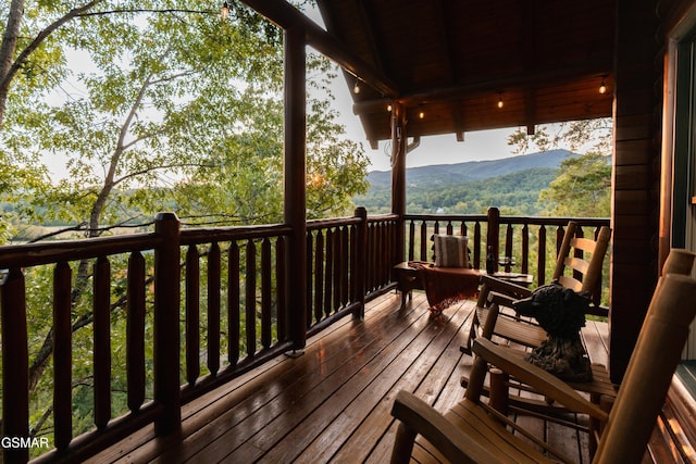 wooden terrace featuring a mountain view