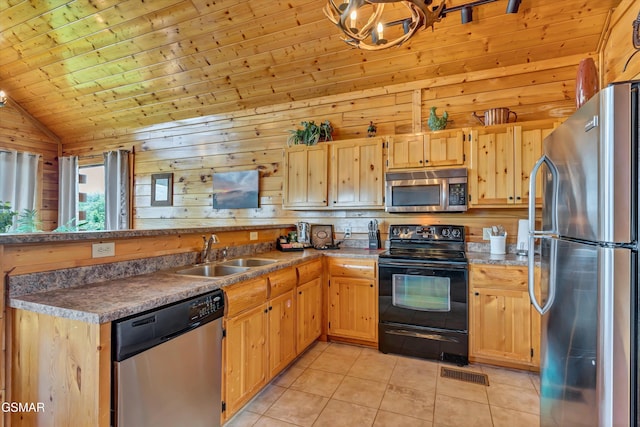 2513 Look Afar View Dr, Sevierville, TN 37876 - kitchen with stainless steel appliances, a peninsula, light brown cabinets, light tile patterned floors, and vaulted ceiling