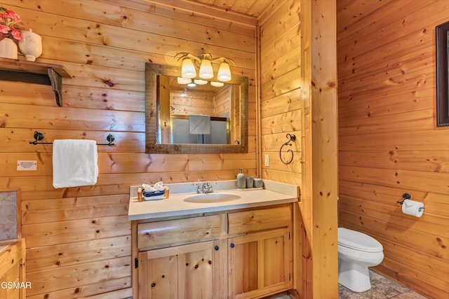 2513 Look Afar View Dr, Sevierville, TN 37876 - bathroom with wood walls, vanity, and a chandelier